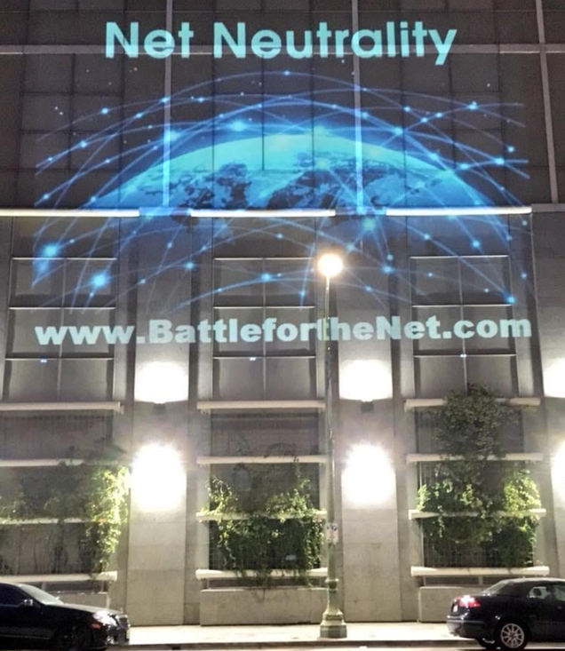 Activists project messages about Assemblyman Miguel Santiago and net neutrality on the AT&T building in Oakland, June 20, 2018. Photo: Alan Marling (Used with permission).